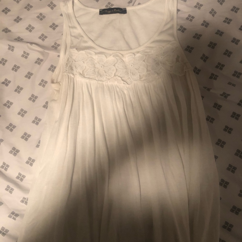 white tank top with a floral detail